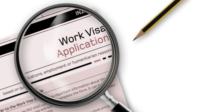 a paper with magnifying glass over the title which reads "Work Visa Application", and a pencil lying nearby